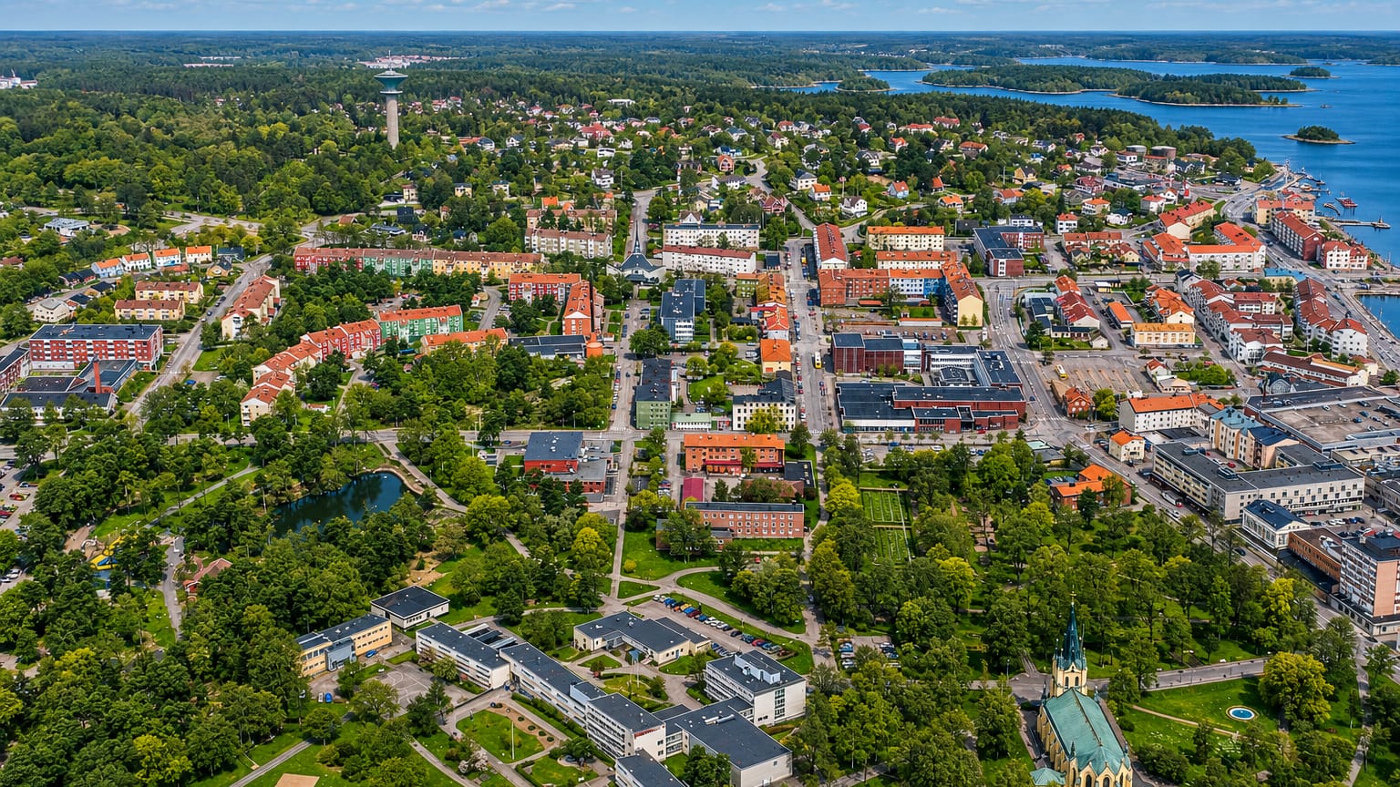 Aerial view of Oskarshamn's colourful town centre, water tower and harbour on the Baltic archipelago coast.