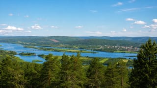 Panorama over the Torne River valley and forests toward the small town of Övertorneå, Sweden.