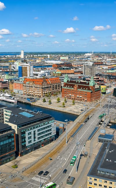 Aerial over Malmo's harbour district with the Turning Torso tower rising in the distance