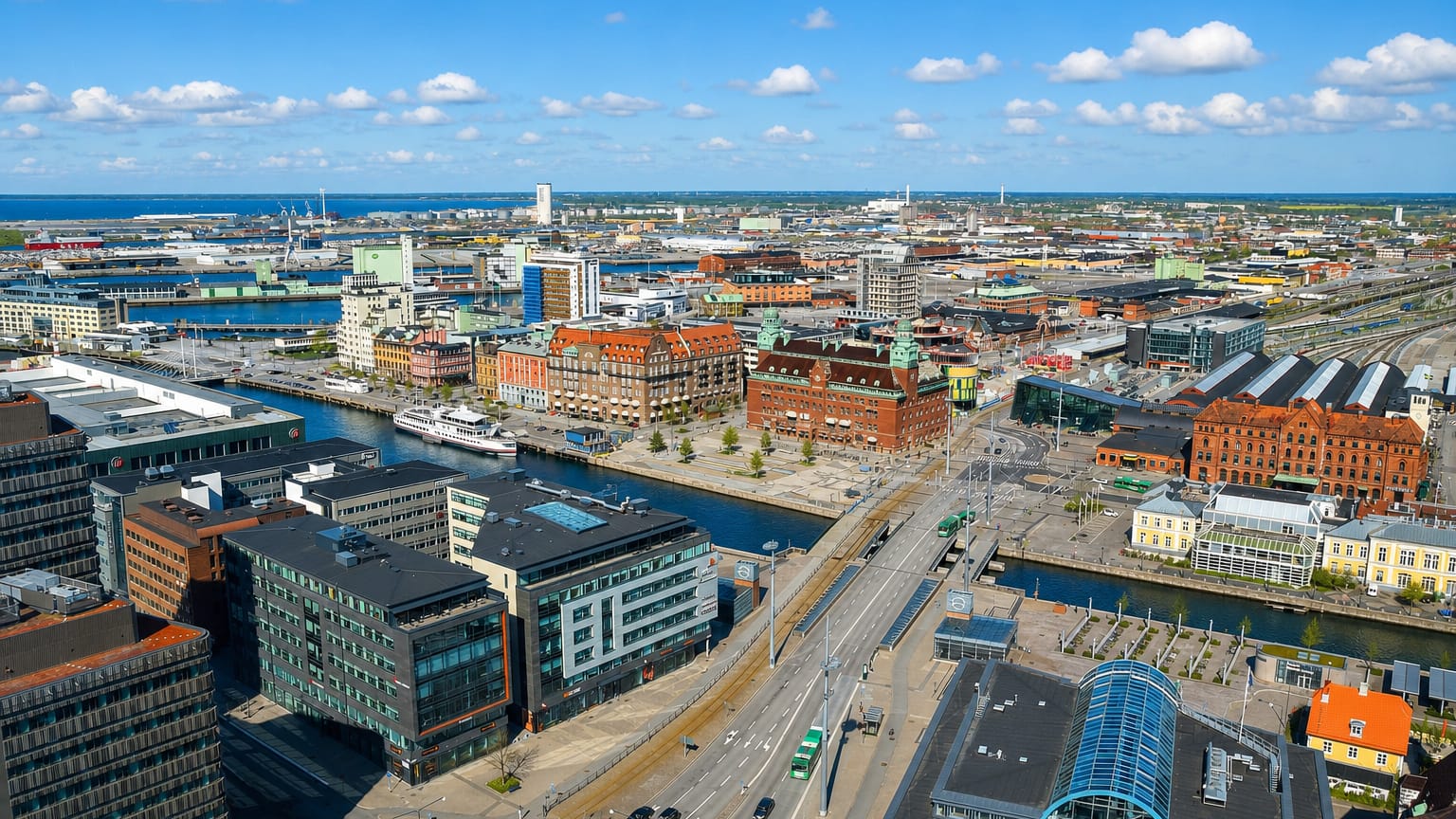 Aerial over Malmo's harbour district with the Turning Torso tower rising in the distance