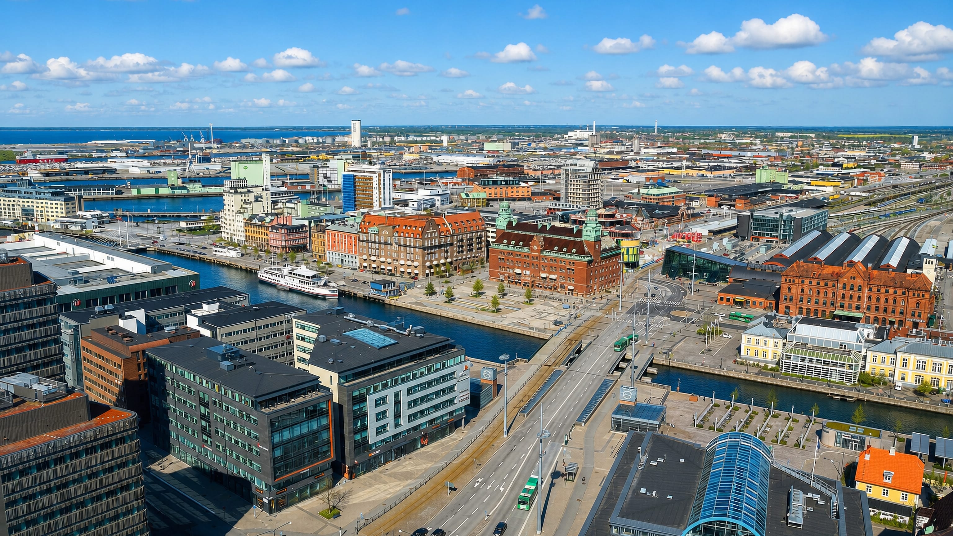 Aerial over Malmo's harbour district with the Turning Torso tower rising in the distance