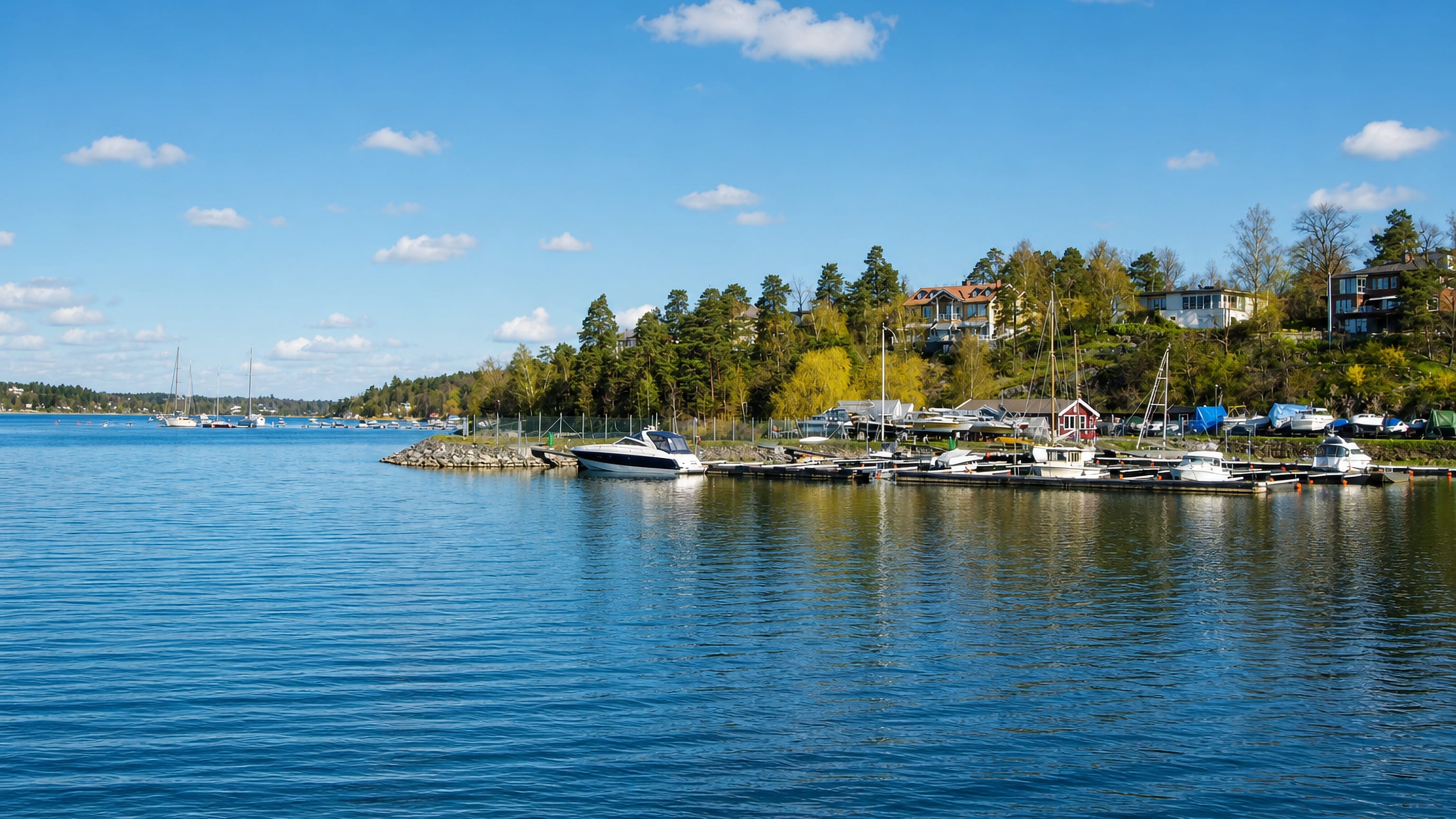 Marina and waterside villas on the wooded shore at Islinge, Lidingö, in the Stockholm archipelago.