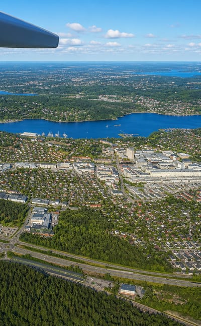 Aerial view from a plane over Sollentuna's suburbs, lakes and forests north of Stockholm, Sweden.