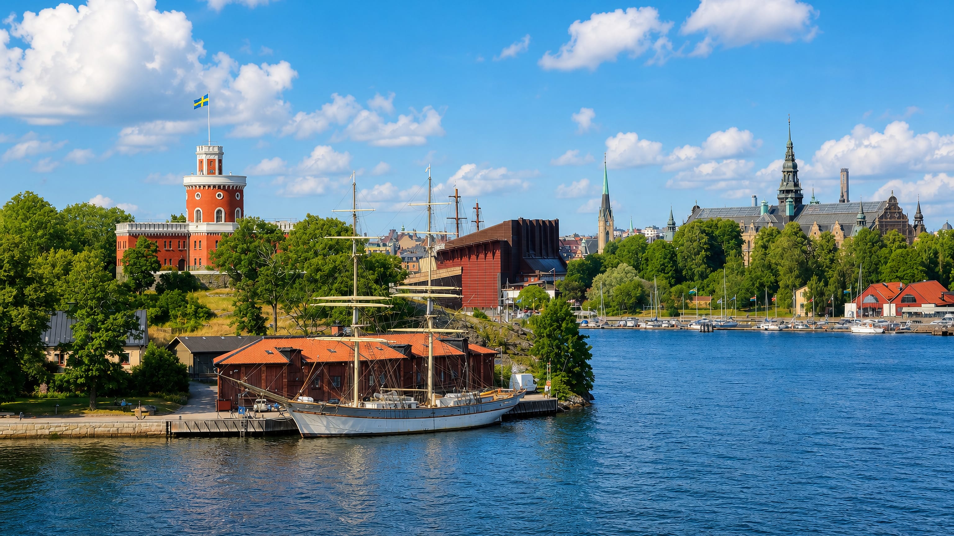 Stockholm waterfront by Djurgarden, with a moored sailing ship, the Kastellet tower and Nordiska museet spires