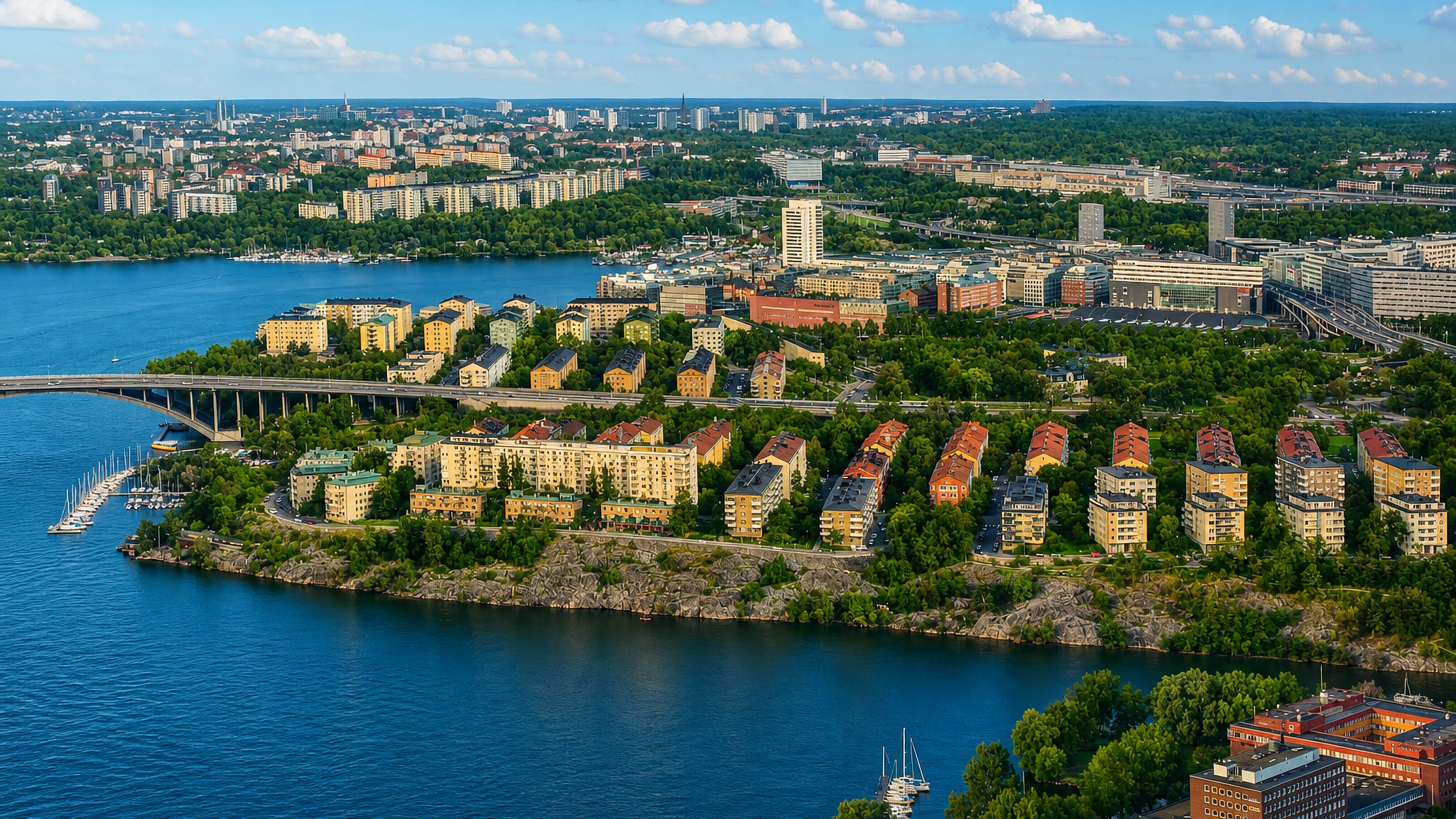 Aerial view of Fredhäll's functionalist blocks on Kungsholmen's cliffs, with marina and bridge, Stockholm.