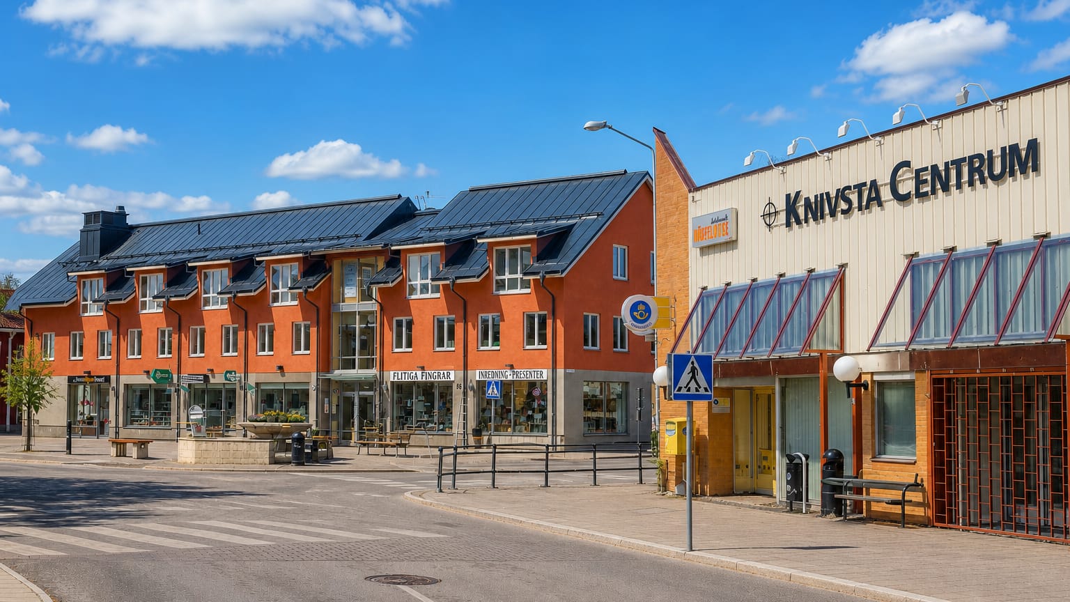 Knivsta Centrum shopping street with orange apartment blocks and shopfronts under a blue sky, Sweden.