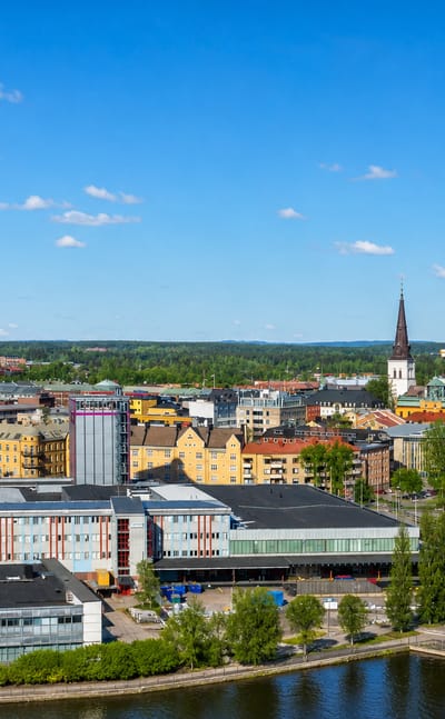 Karlstad city centre along the Klaralven river with the cathedral spire and low-rise blocks in Sweden.
