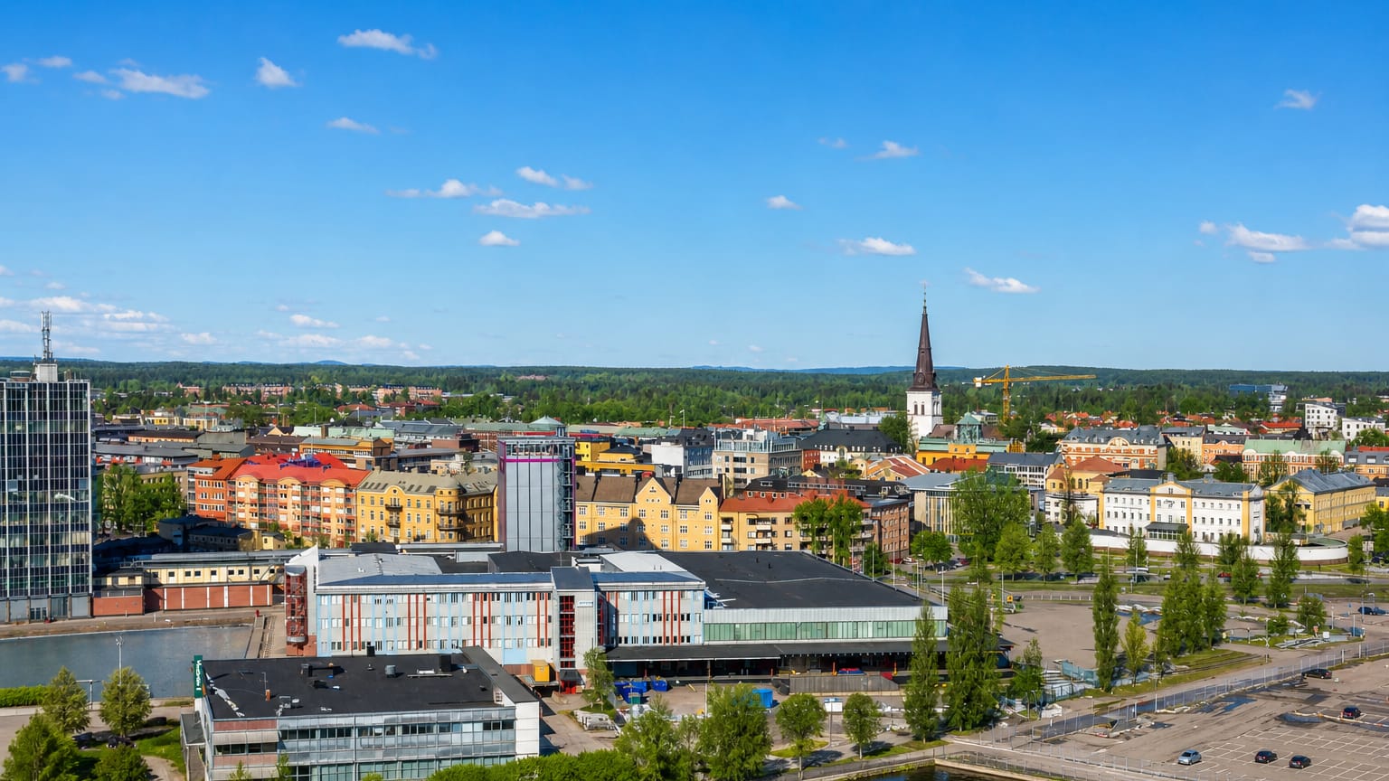 Karlstad city centre along the Klaralven river with the cathedral spire and low-rise blocks in Sweden.