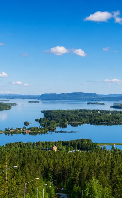 Panorama of Lake Storuman with forested islands and distant hills in Vasterbotten, Sweden