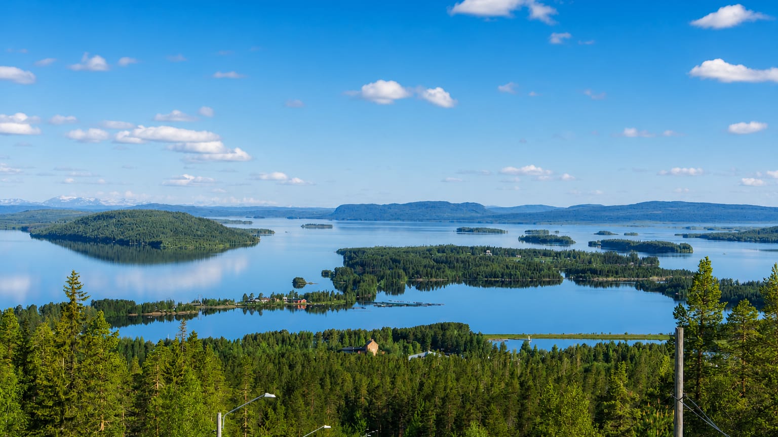 Panorama of Lake Storuman with forested islands and distant hills in Vasterbotten, Sweden