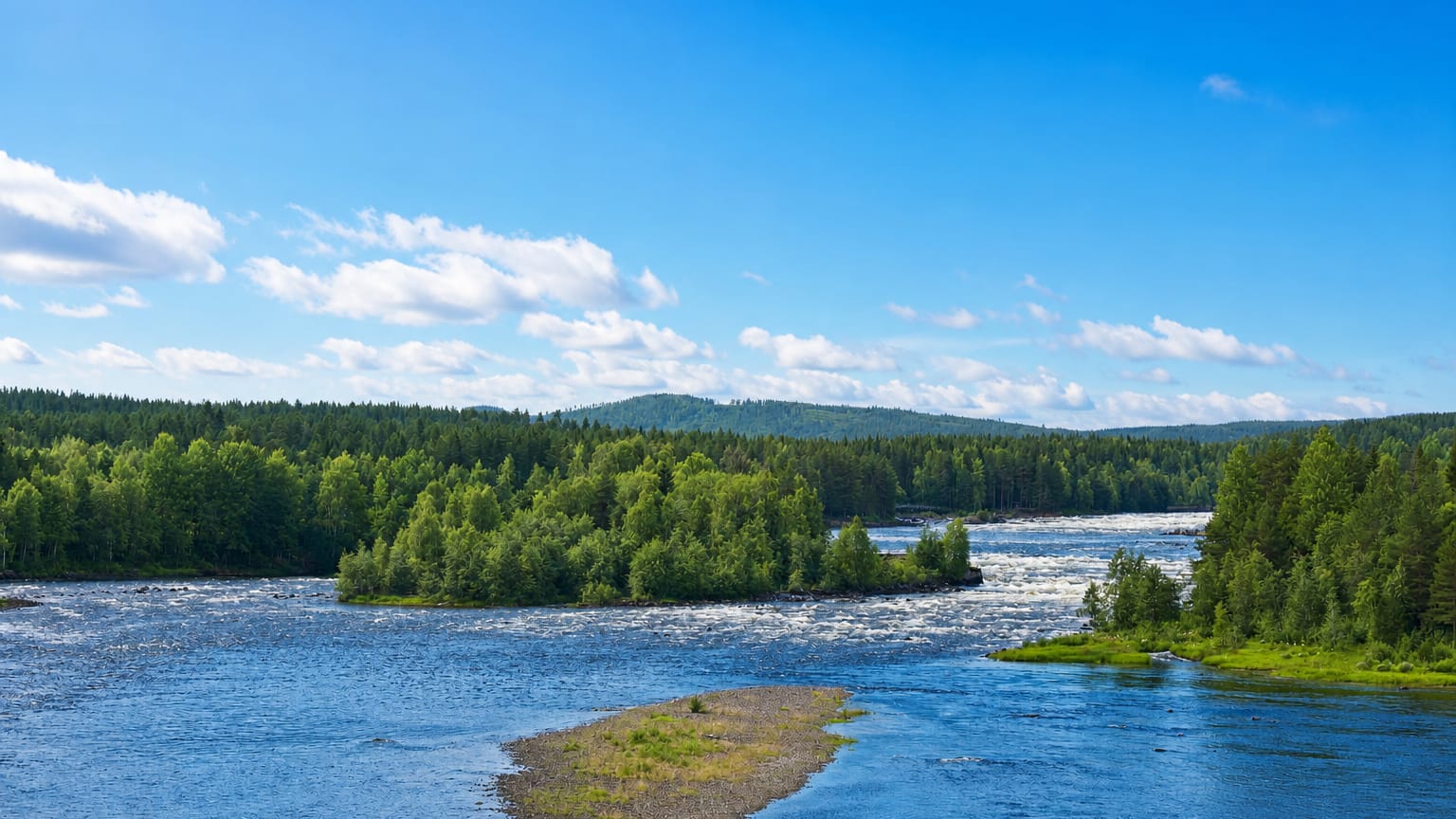 The Vindel River flowing over rapids through dense boreal forest under a blue summer sky at Vindeln, Sweden.