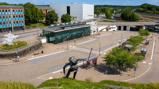 Boras Resecentrum travel hub and its plaza sculpture in central Boras, Sweden, under a clear summer sky.