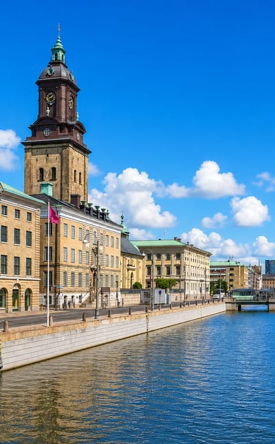 Gothenburg's central canal lined by classic facades with the German Church tower rising behind