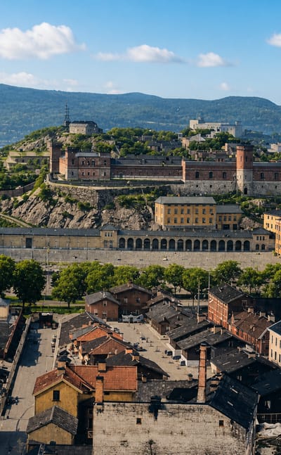 Hilltop fortress above Haga's old district in Gothenburg, Sweden, with red-roofed houses and the harbour beyond.
