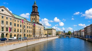 Gothenburg's central canal lined by classic facades with the German Church tower rising behind