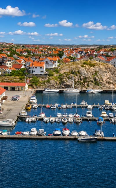 Aerial view of the marina and red-roofed houses of Kungshamn, Sweden, on the rocky Bohuslan coast.