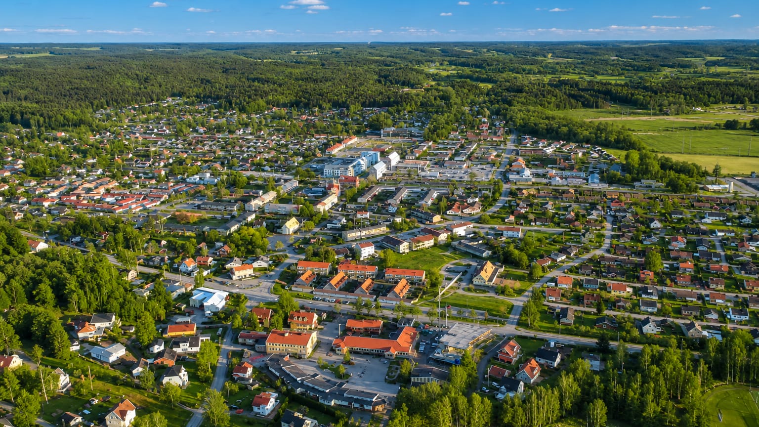Aerial view of Lerum, a small town surrounded by forest and fields, Sweden