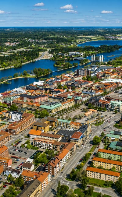 Aerial view of Trollhattan straddling the Gota river and canal locks with a distinctive round tower, Sweden.