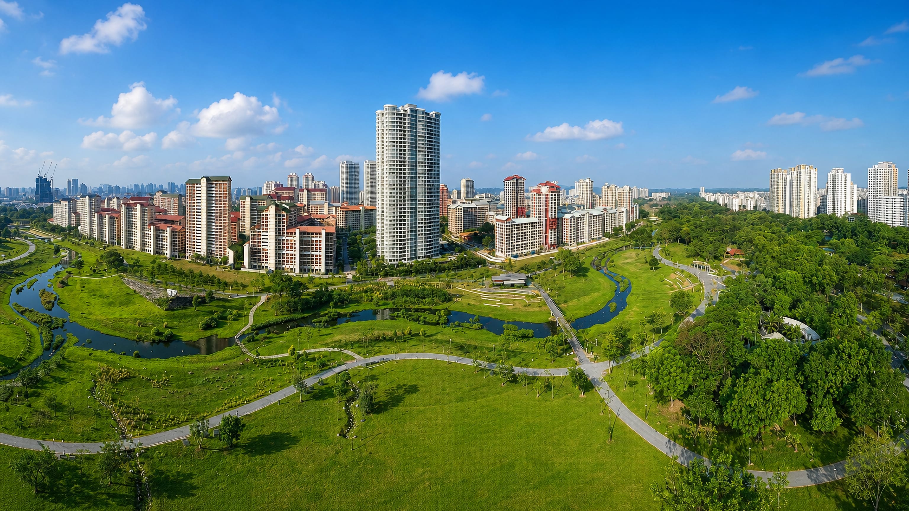 High-rise housing blocks above the winding river and lawns of Bishan-Ang Mo Kio Park, Singapore.