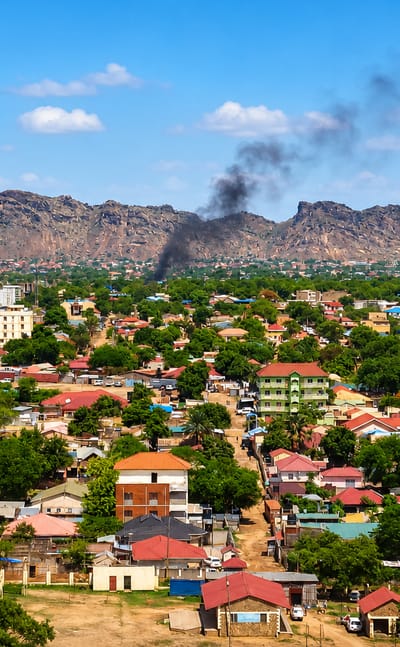 Aerial view of Juba's low-rise sprawl below the rocky ridge of Jebel Kujur in South Sudan.