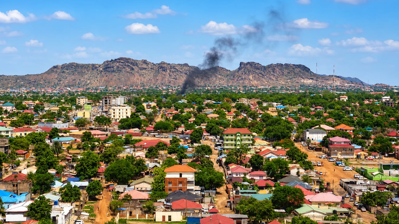 Aerial view of Juba's low-rise sprawl below the rocky ridge of Jebel Kujur in South Sudan.