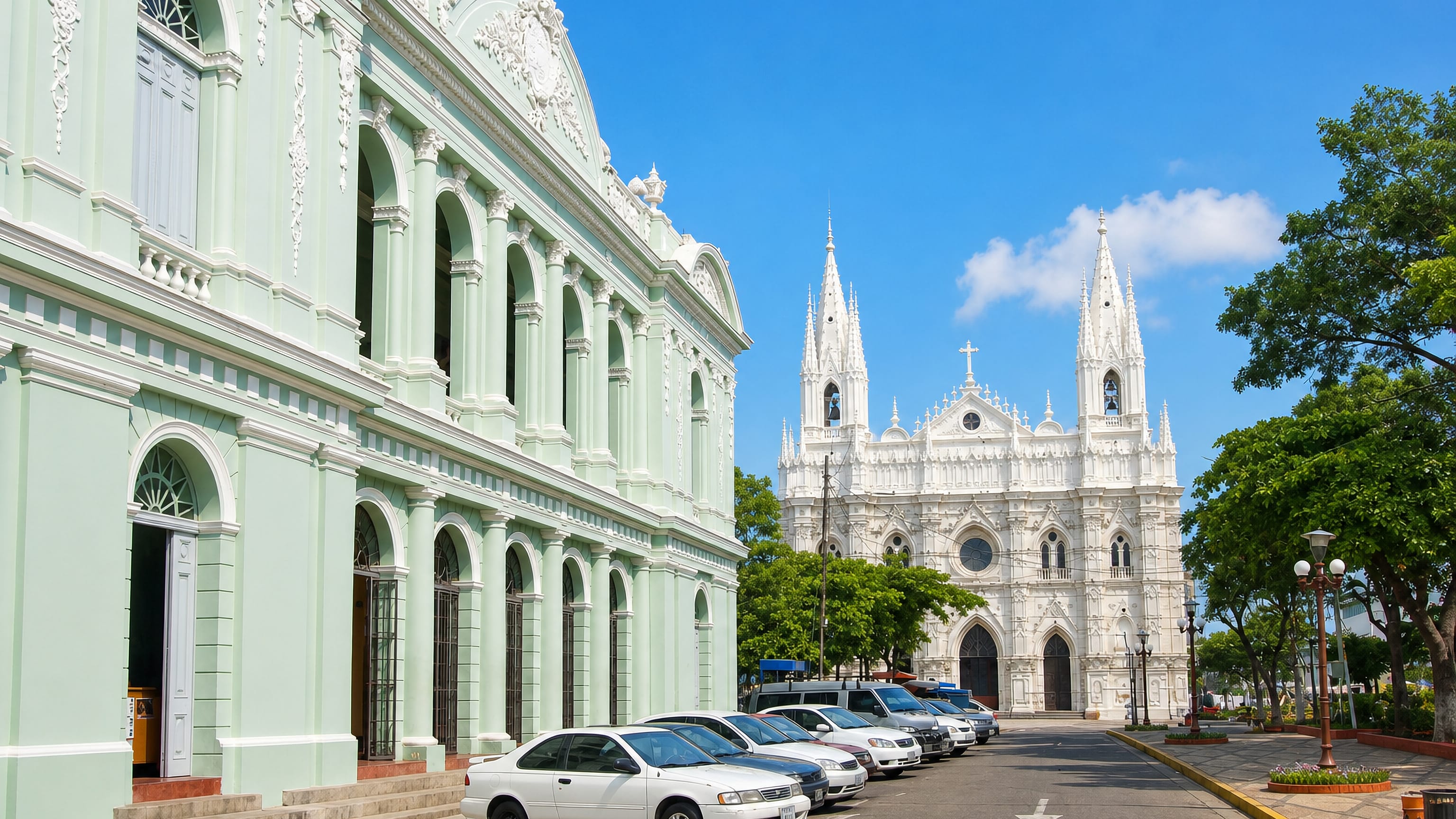 The white Gothic cathedral and the theatre facing Parque Libertad in Santa Ana, El Salvador