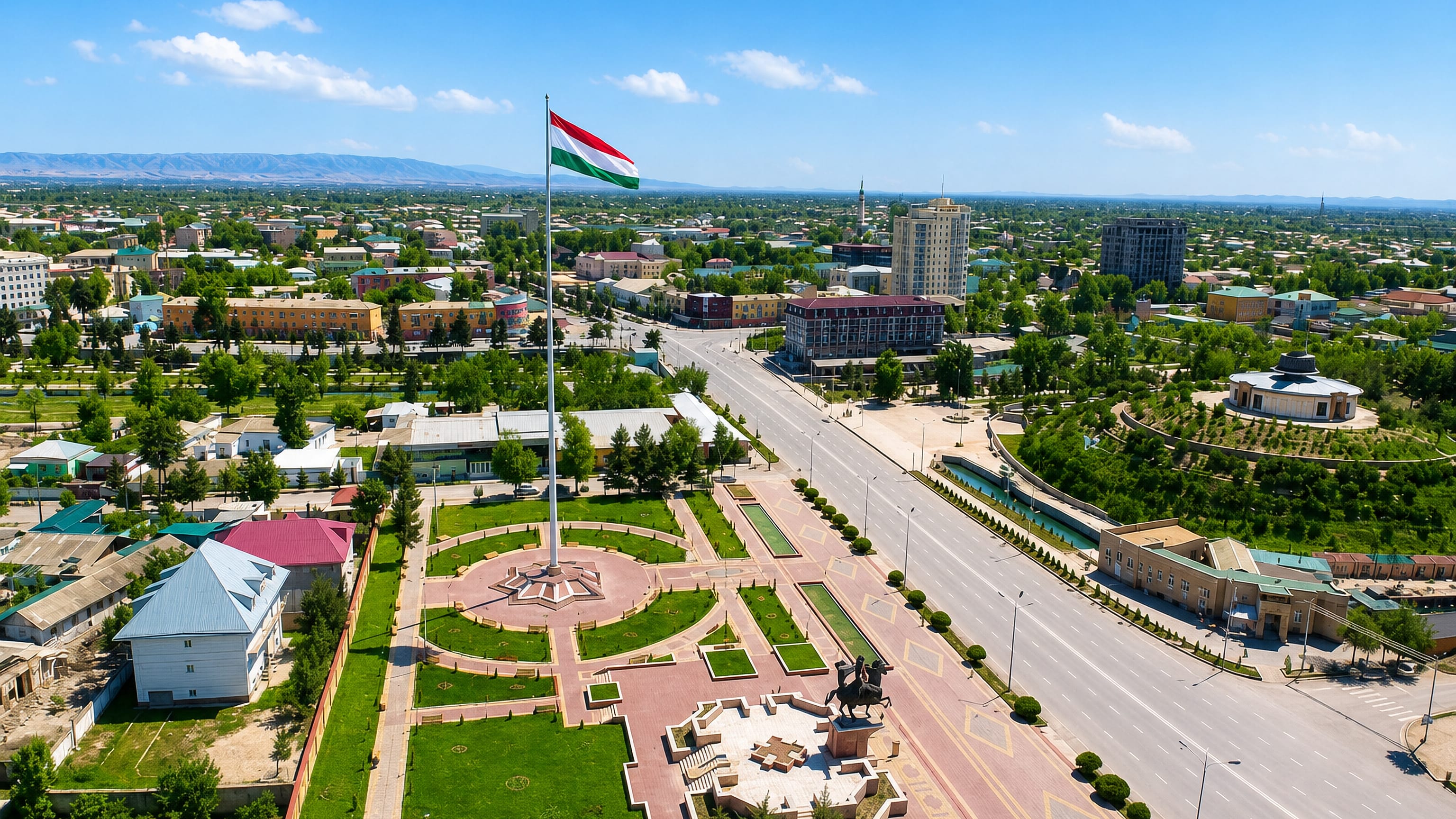 Aerial view of Bokhtar, Tajikistan, with its tall national flagpole, central square and equestrian statue