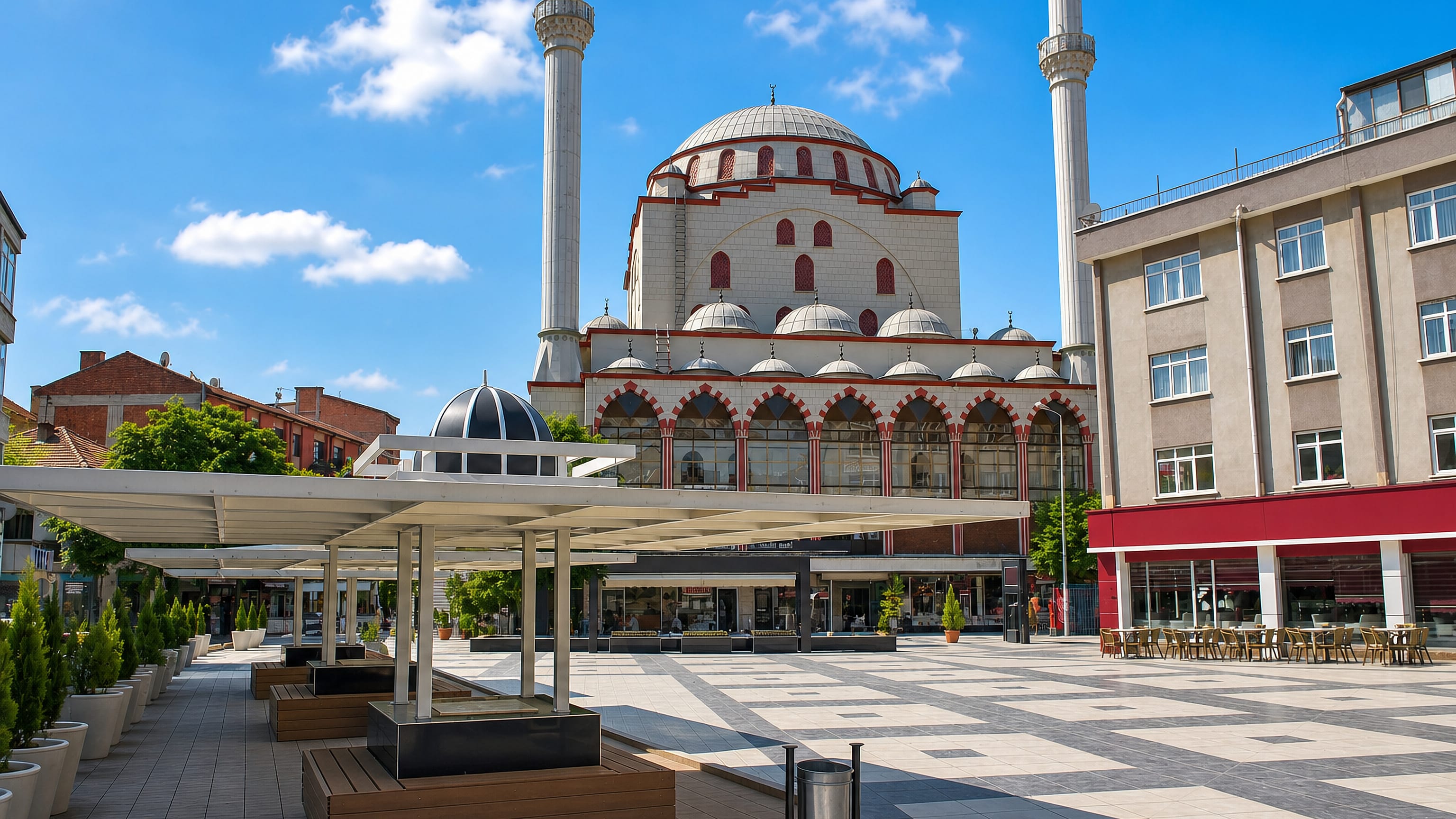 Domed mosque with twin minarets rising over the paved central square of Polatlı, Ankara Province, Turkey