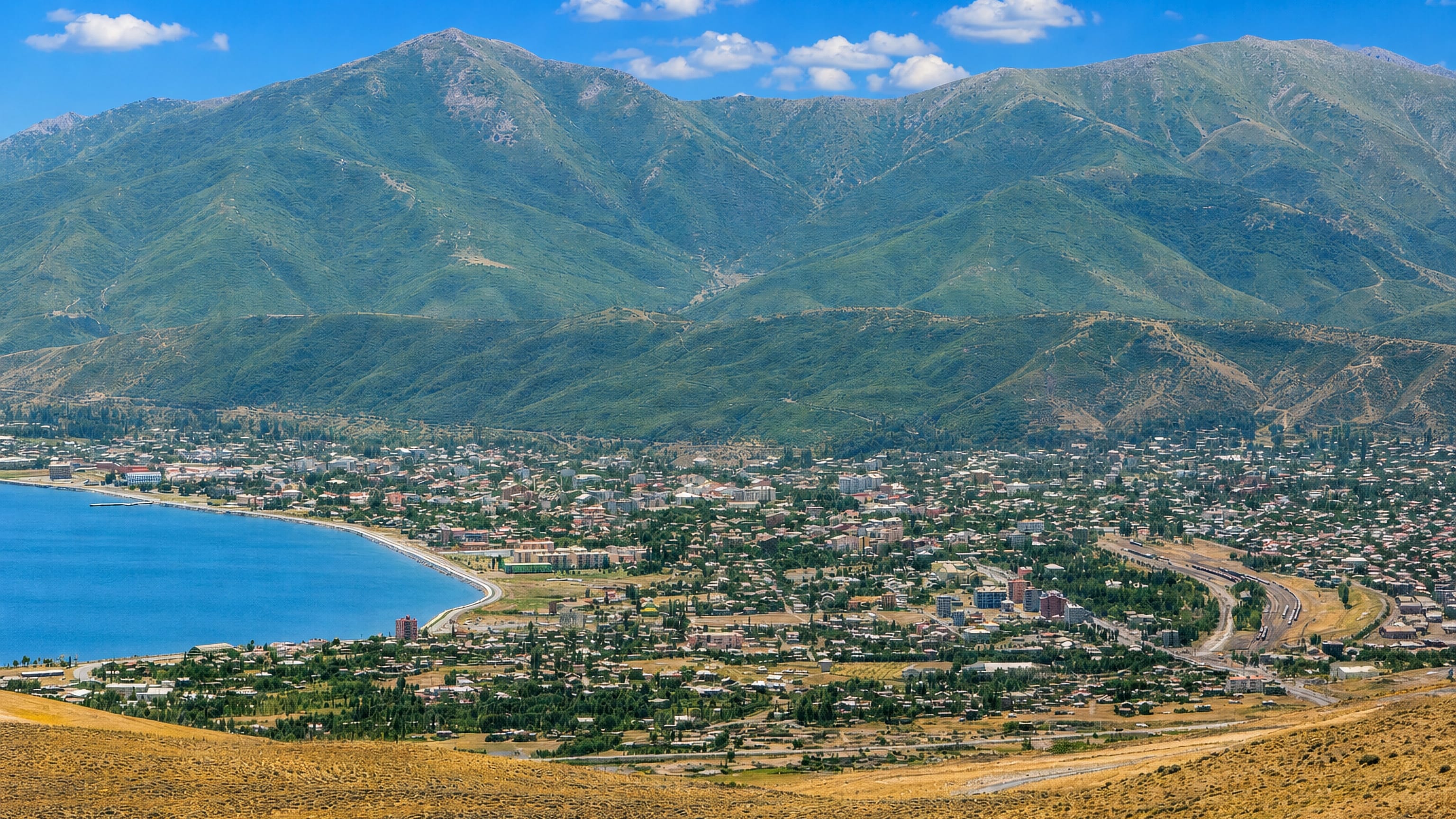 Tatvan spread along the shore of Lake Van, Turkey, beneath green mountain ridges.