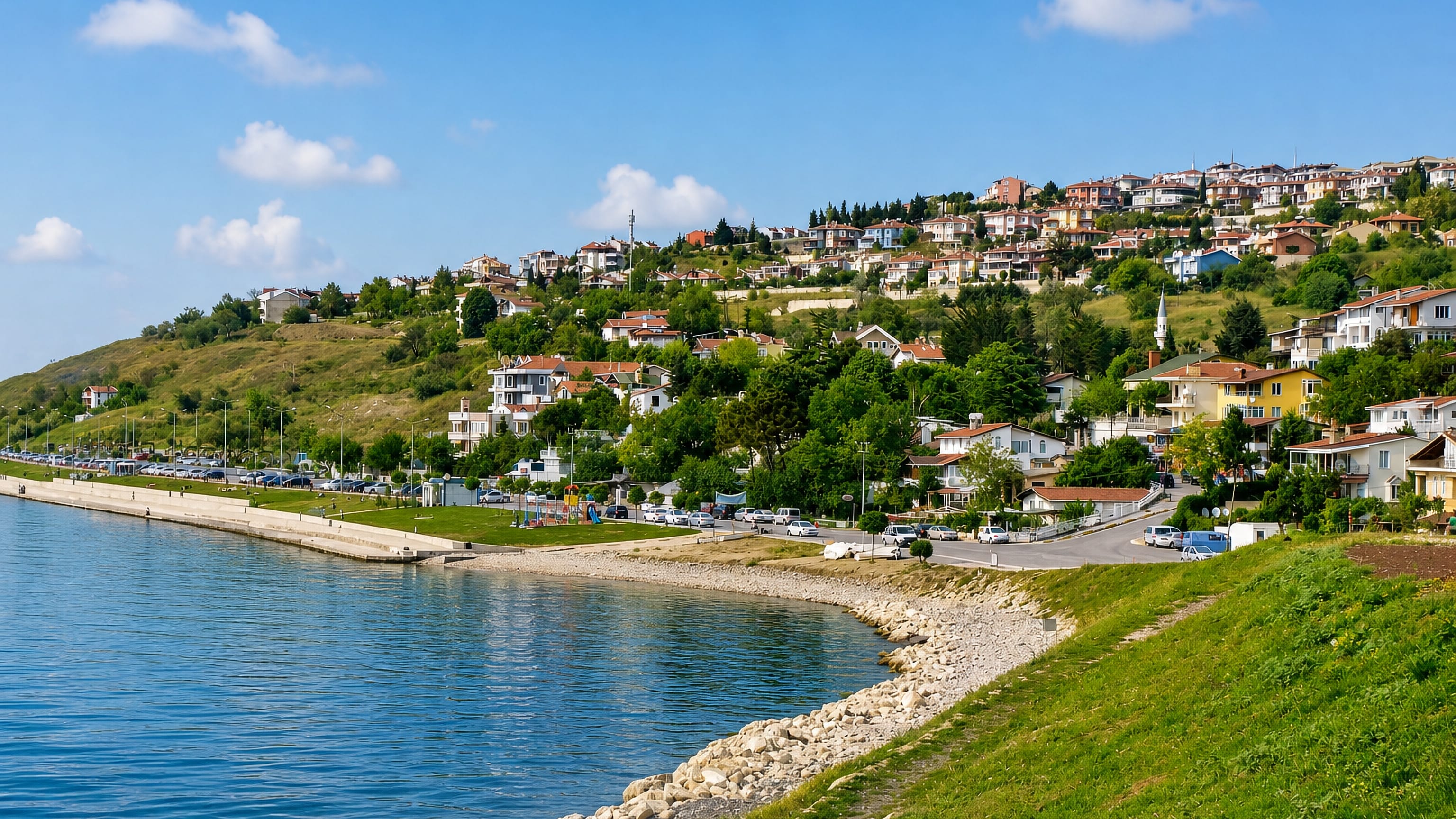 Seafront promenade and hillside houses with a minaret above the Marmara shore at Beylikdüzü, Istanbul.