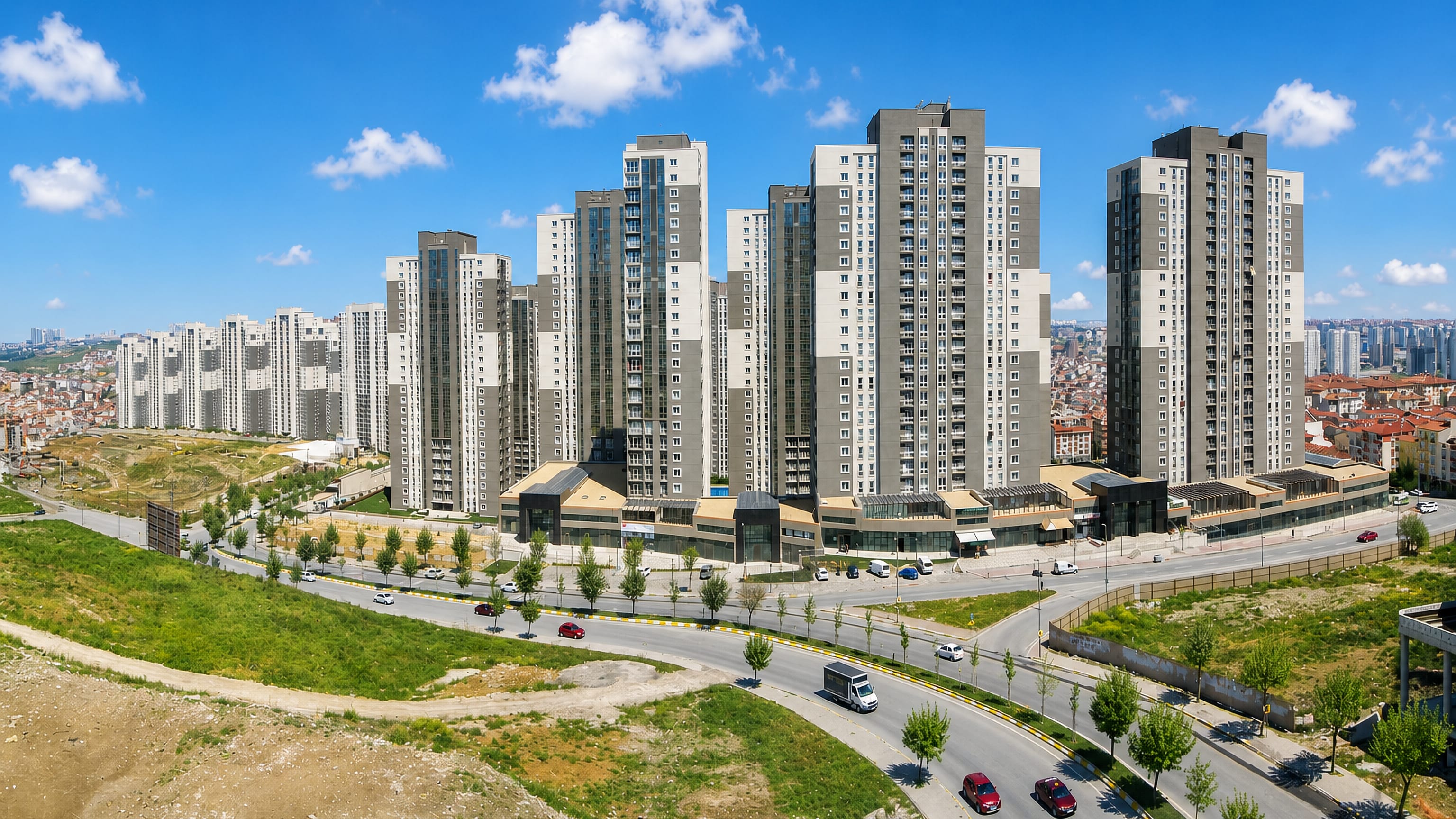 Clusters of new residential high-rises above a curving road in Esenyurt, Istanbul