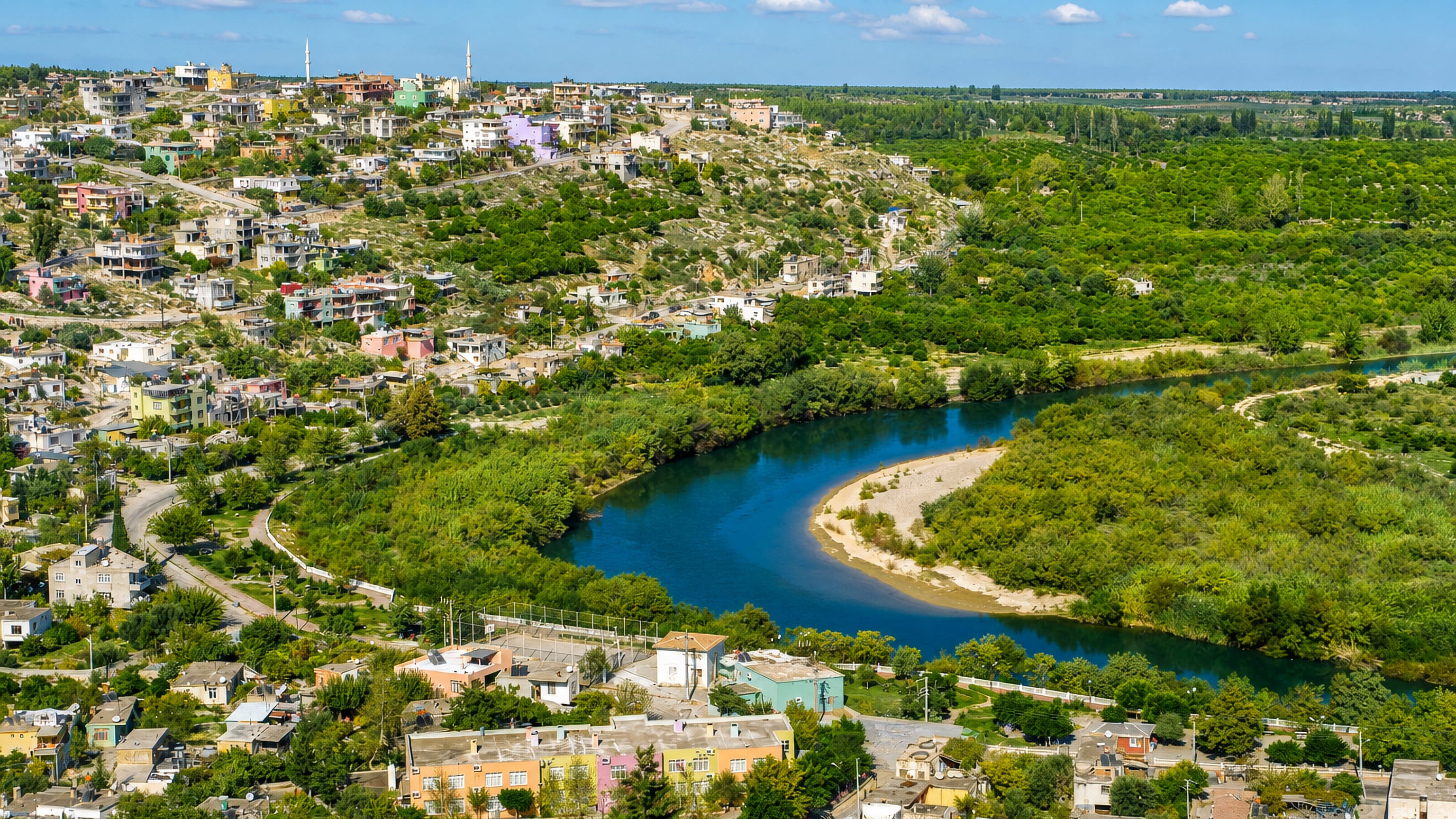 Silifke, Turkey, on hillsides above a bend of the Goksu River amid green orchards