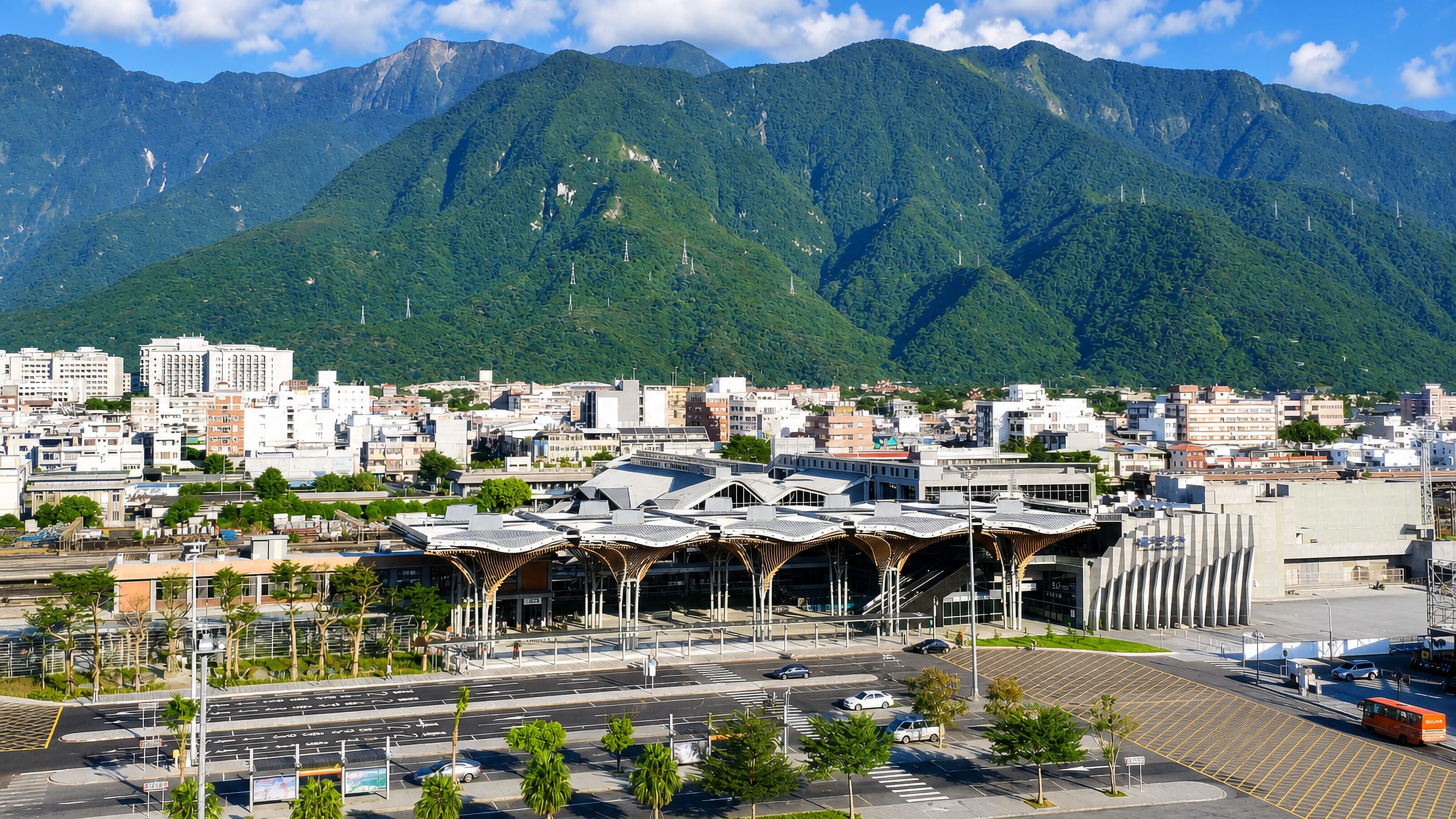 Hualien City, Taiwan, with its curved wooden-canopy railway station below the Central Mountain Range.