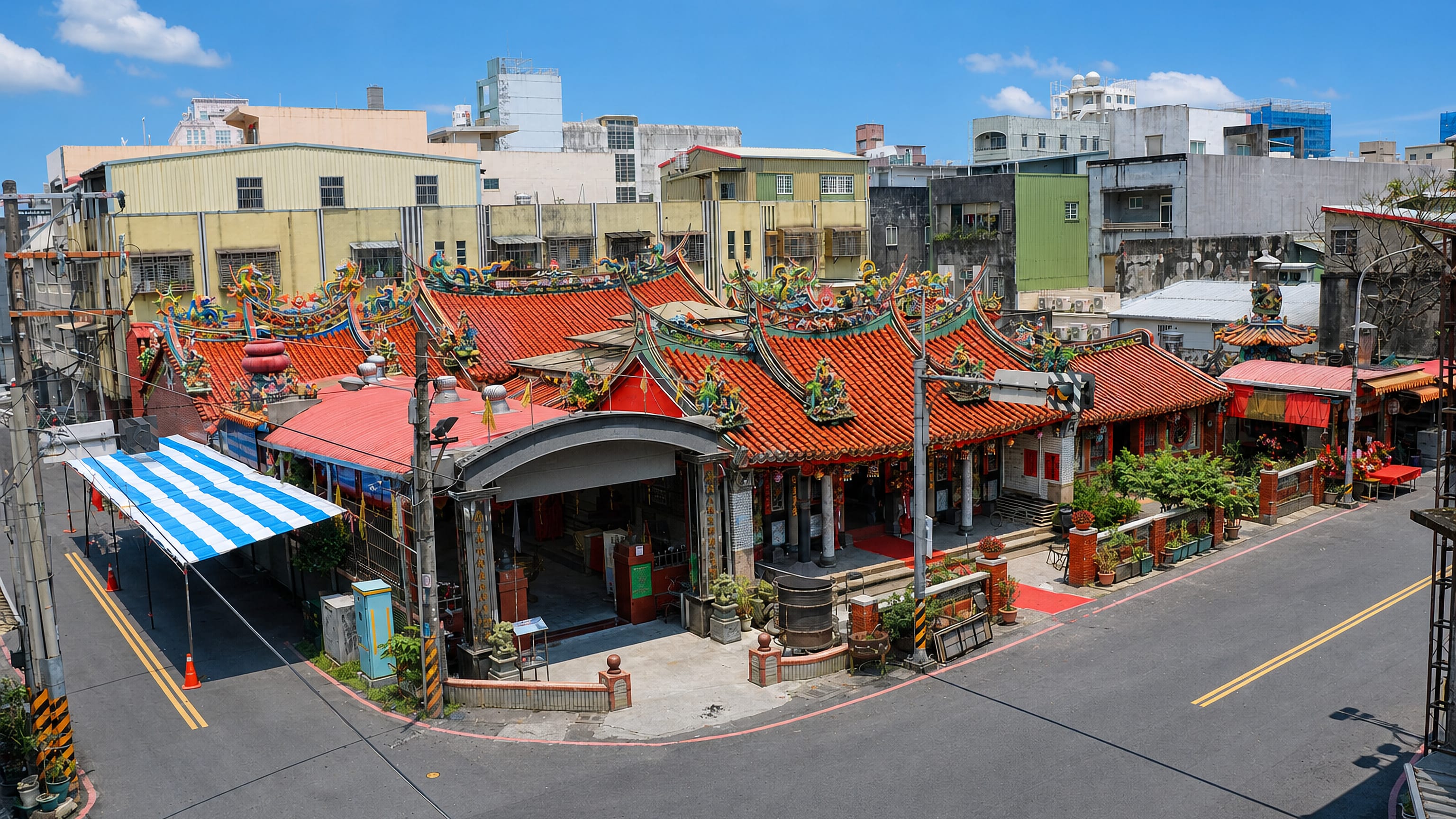 Ornate Chinese-style temple with dragon-crested tiled roofs at the heart of the townscape in Yilan, Taiwan.