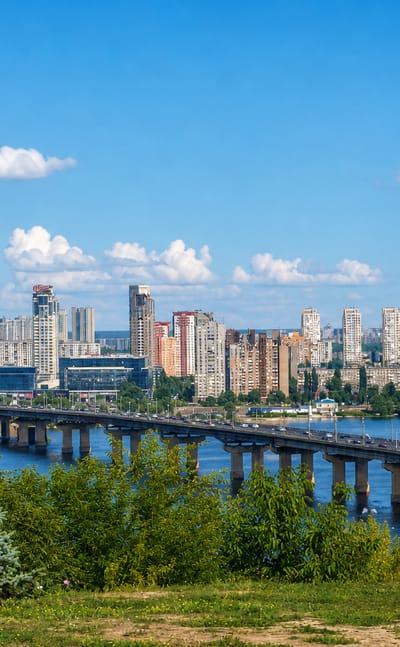 Left-bank high-rises of Darnytskyi District behind the Paton Bridge across the Dnieper in Kyiv