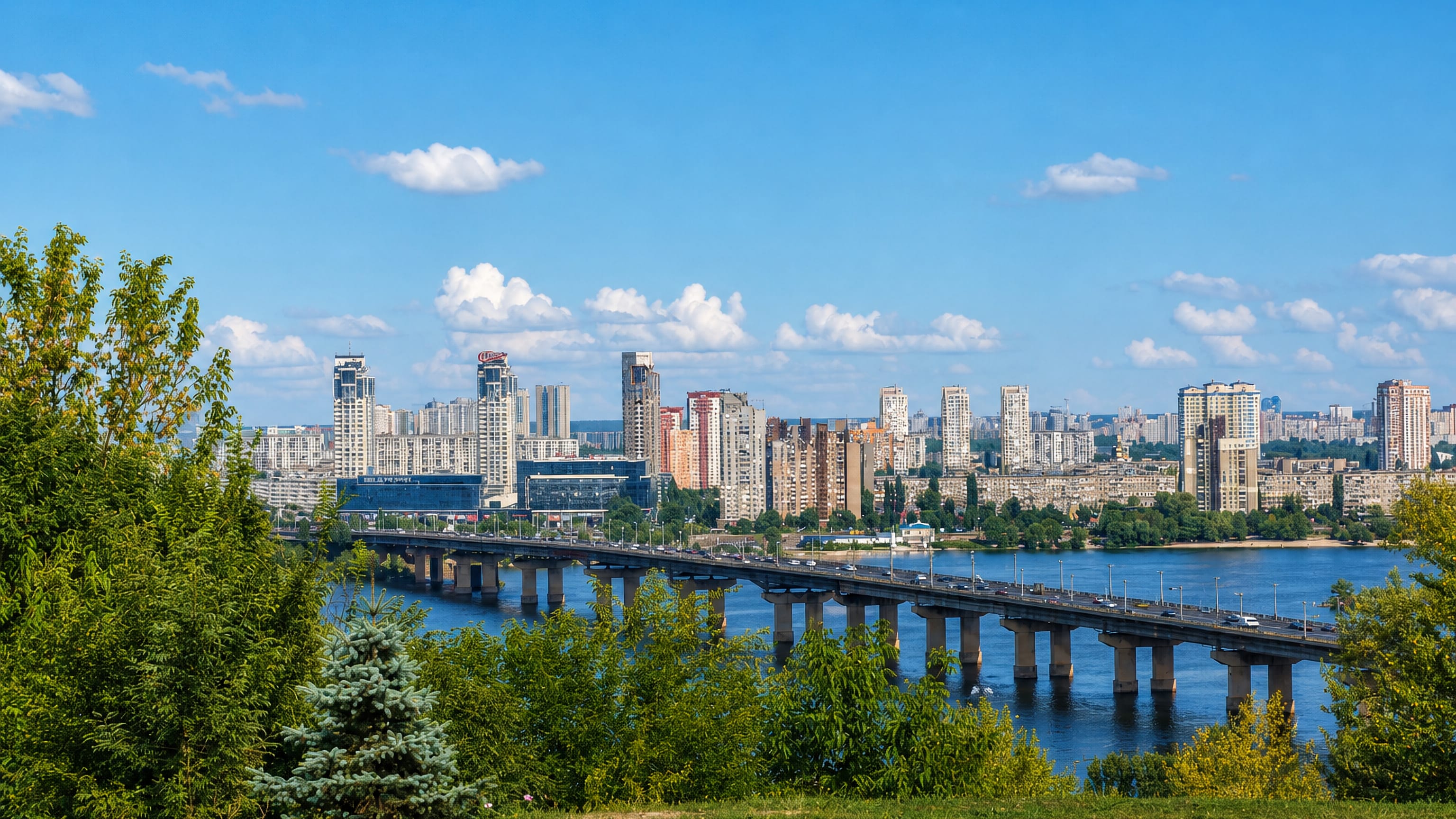 Left-bank high-rises of Darnytskyi District behind the Paton Bridge across the Dnieper in Kyiv