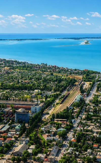 Aerial view of Berdyansk, Ukraine, overlooking the town and the curving sandbar spit reaching into the Sea of Azov.