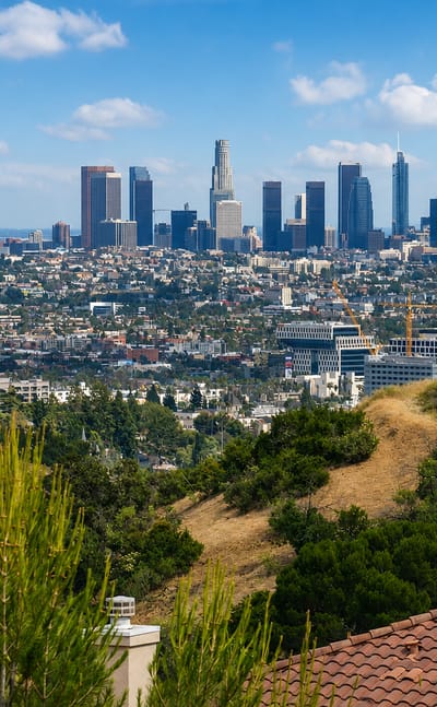 View from the Hollywood Hills over rooftops toward the Downtown Los Angeles skyline