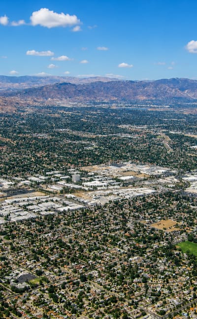 Aerial view of the Northridge suburbs across the San Fernando Valley with mountains rising beyond