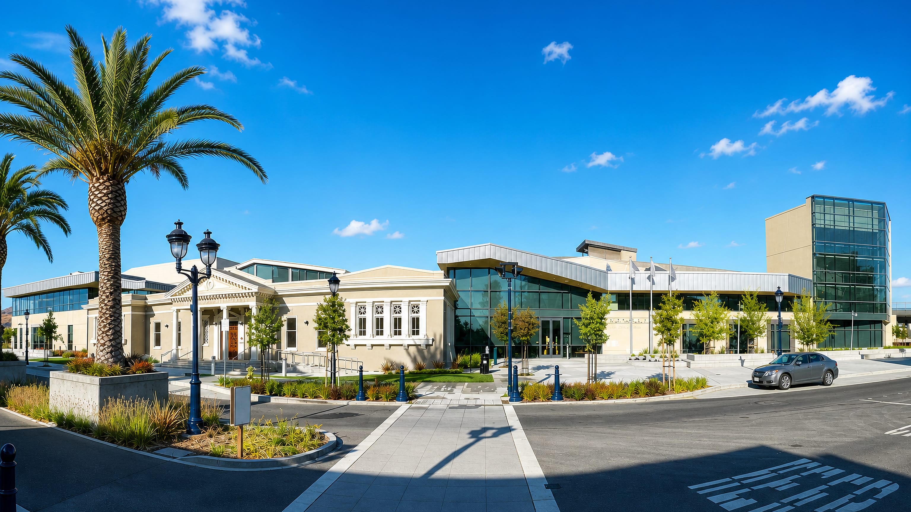 Civic centre and library complex with palms and a landscaped plaza in Milpitas, California.