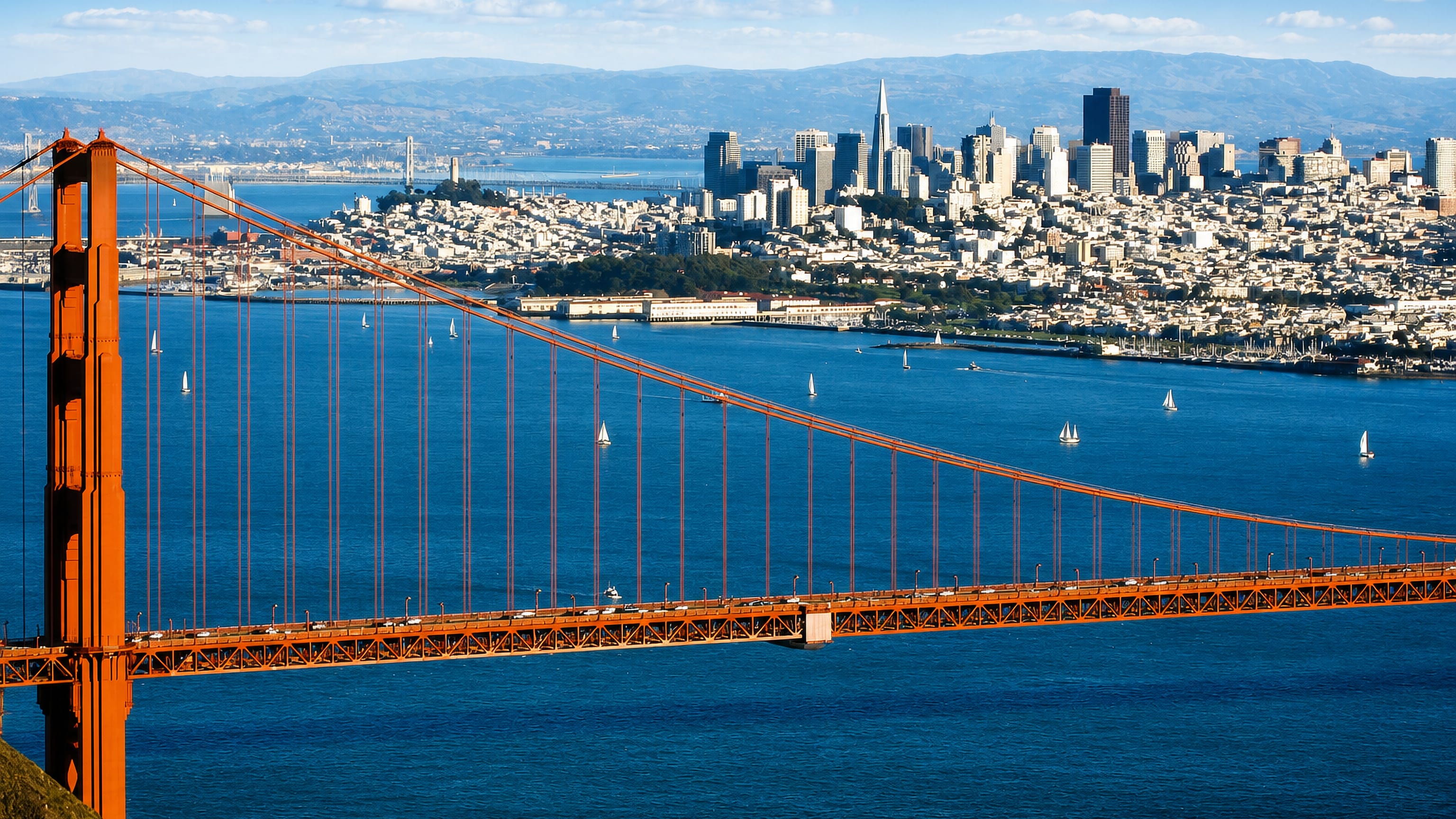 San Francisco's downtown skyline behind the Golden Gate Bridge, above the city's historic Barbary Coast district.