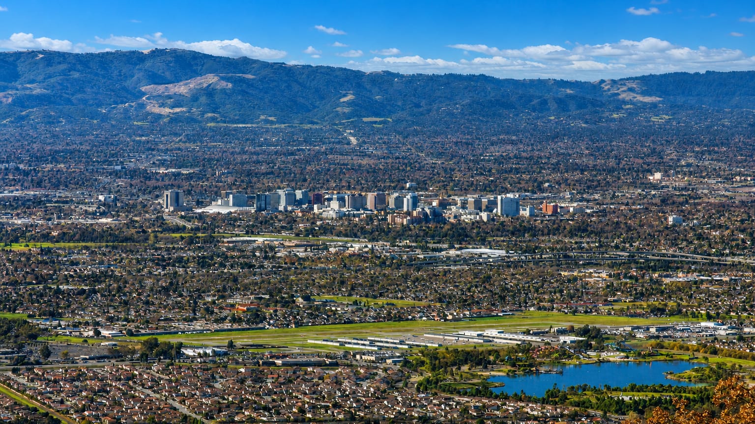 Aerial view of downtown San Jose in the Santa Clara Valley backed by the surrounding hills