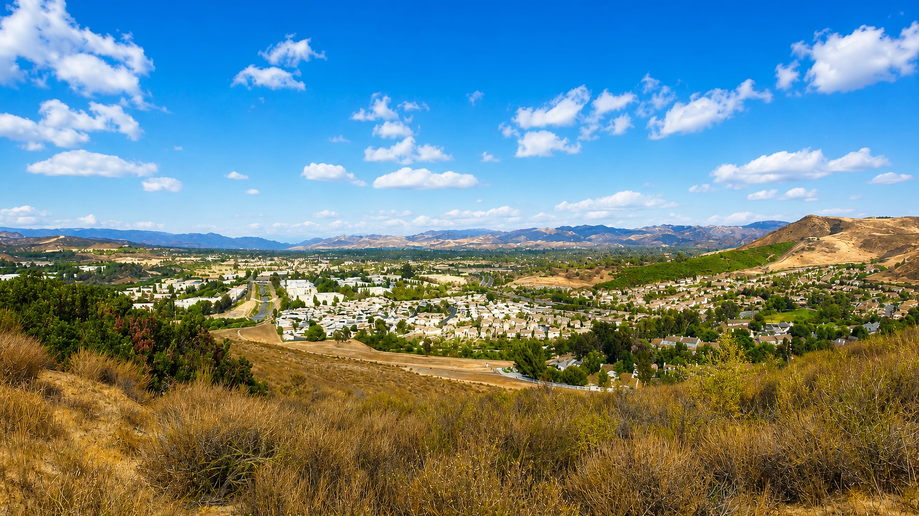 Simi Valley's suburban streets spread across the valley floor below dry chaparral hills in Southern California