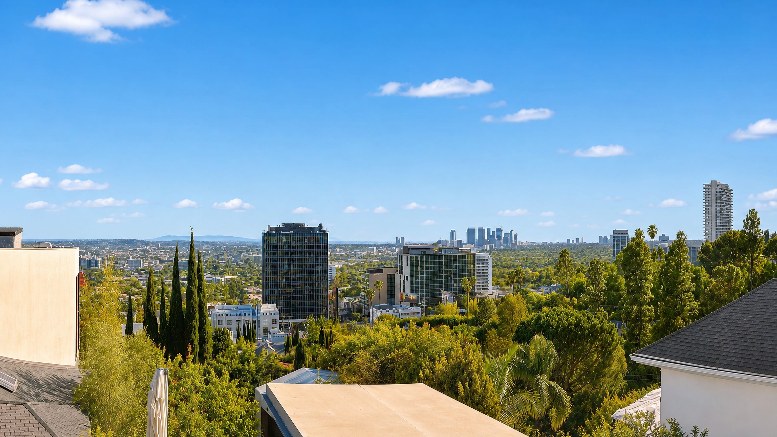 Hillside view over West Hollywood's Sunset Strip mid-rises toward the distant Century City skyline