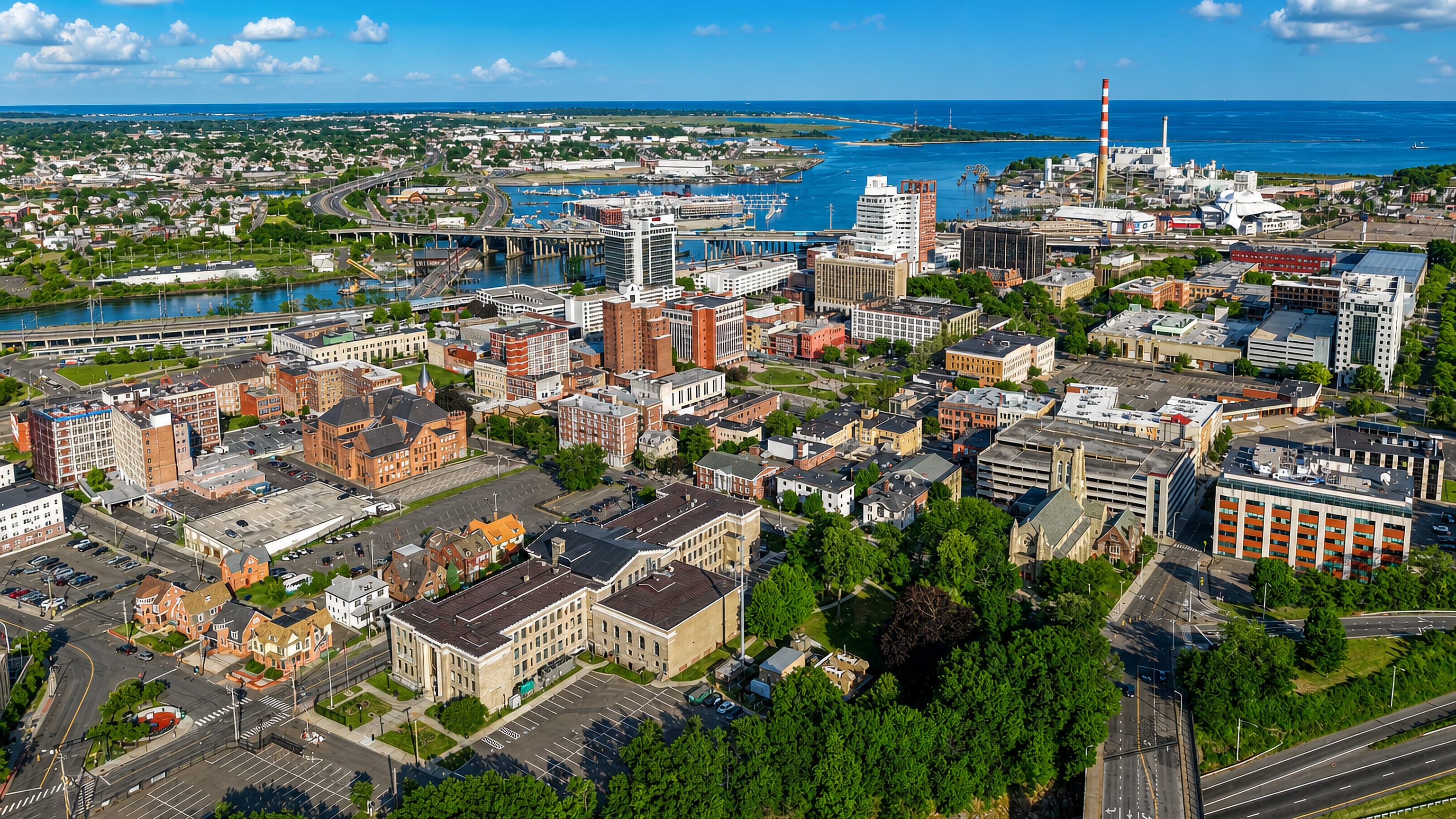 Aerial view over downtown Bridgeport, Connecticut, its harbour, marina and Long Island Sound shoreline.