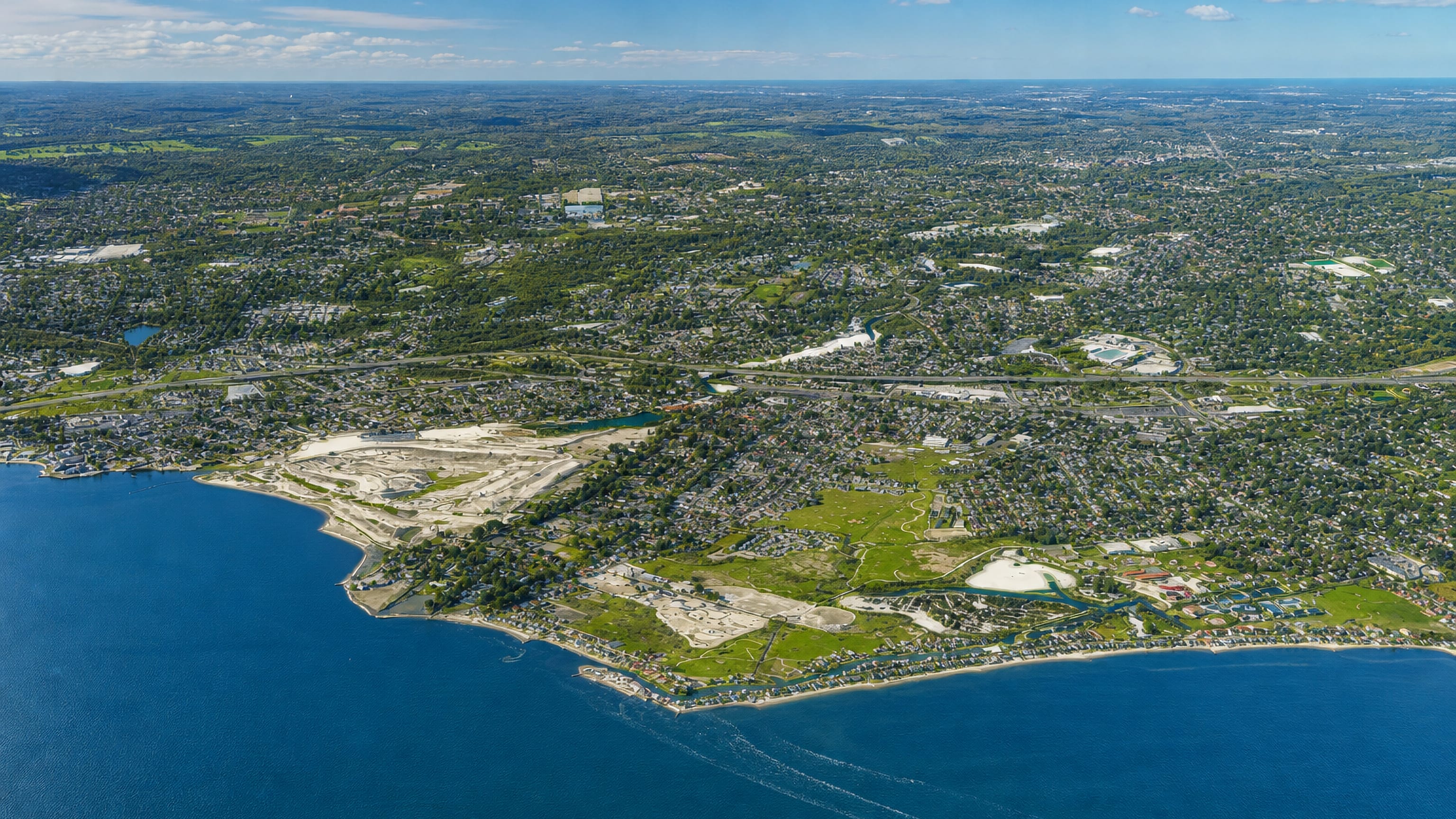 Aerial view of Fairfield, Connecticut's wooded neighbourhoods meeting the Long Island Sound shoreline.