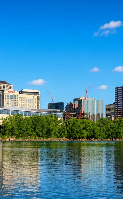 Hartford, Connecticut, skyline with the Travelers Tower and riverfront buildings reflected in the Connecticut River.
