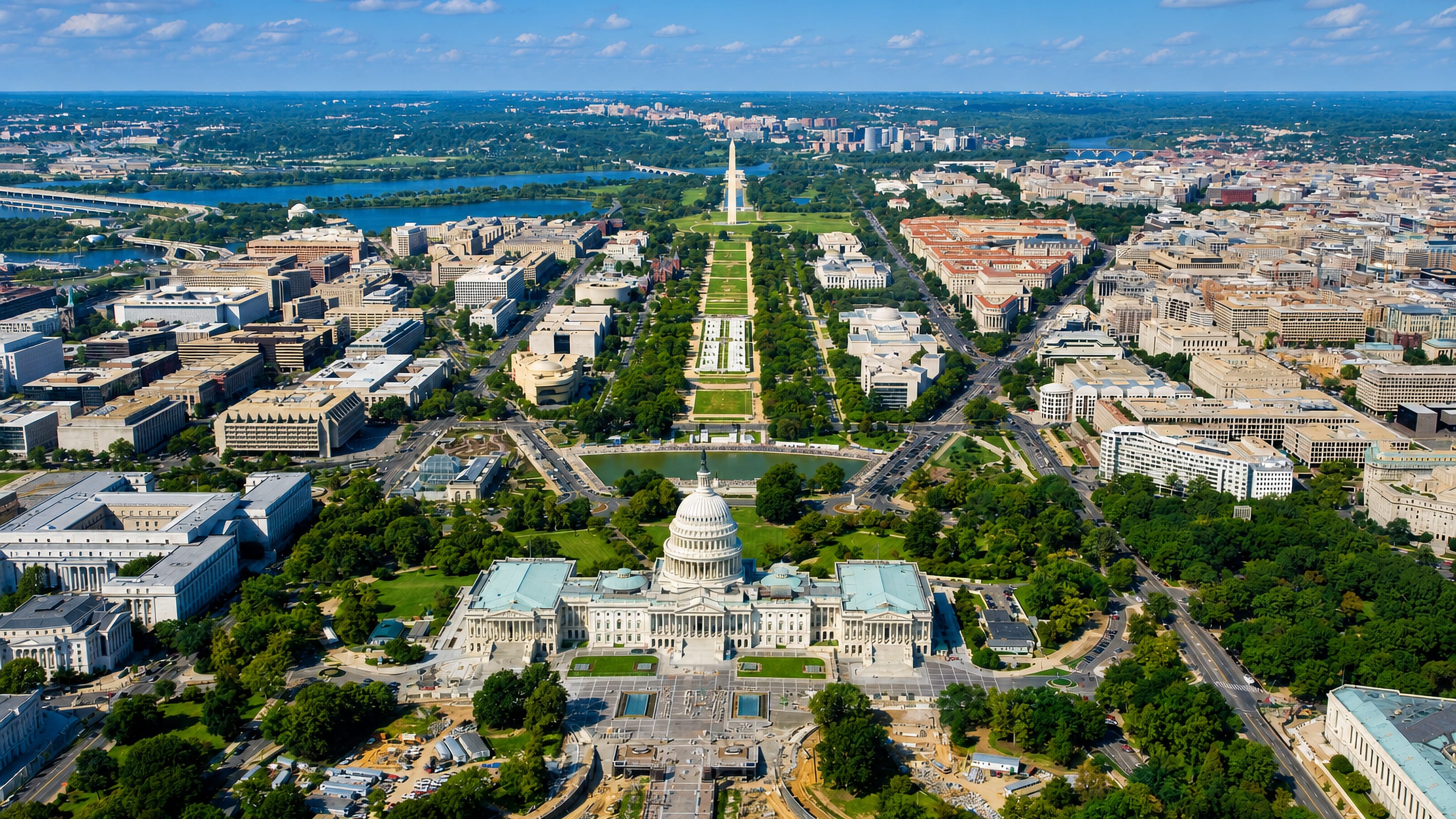 The US Capitol dome above Capitol Hill, Washington DC, with the National Mall and Washington Monument.