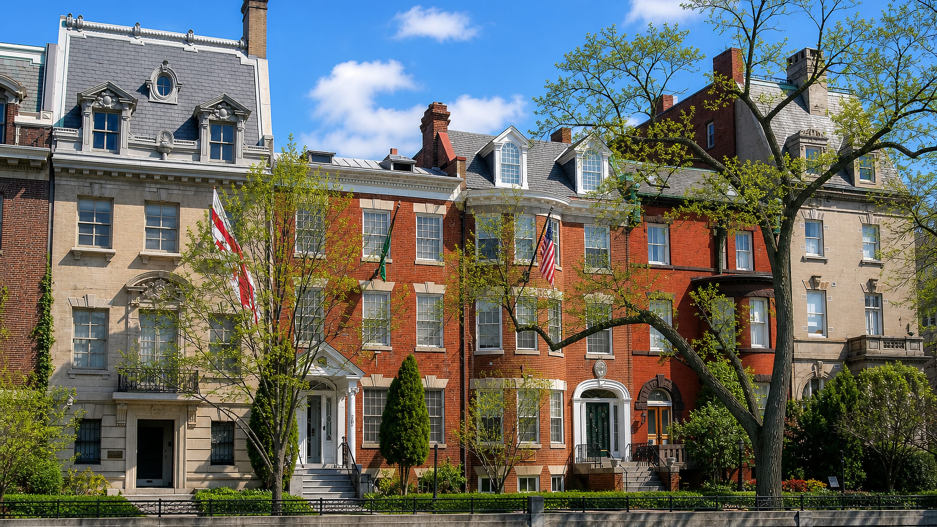 Flag-hung brick and stone mansions along Embassy Row in Washington, DC.