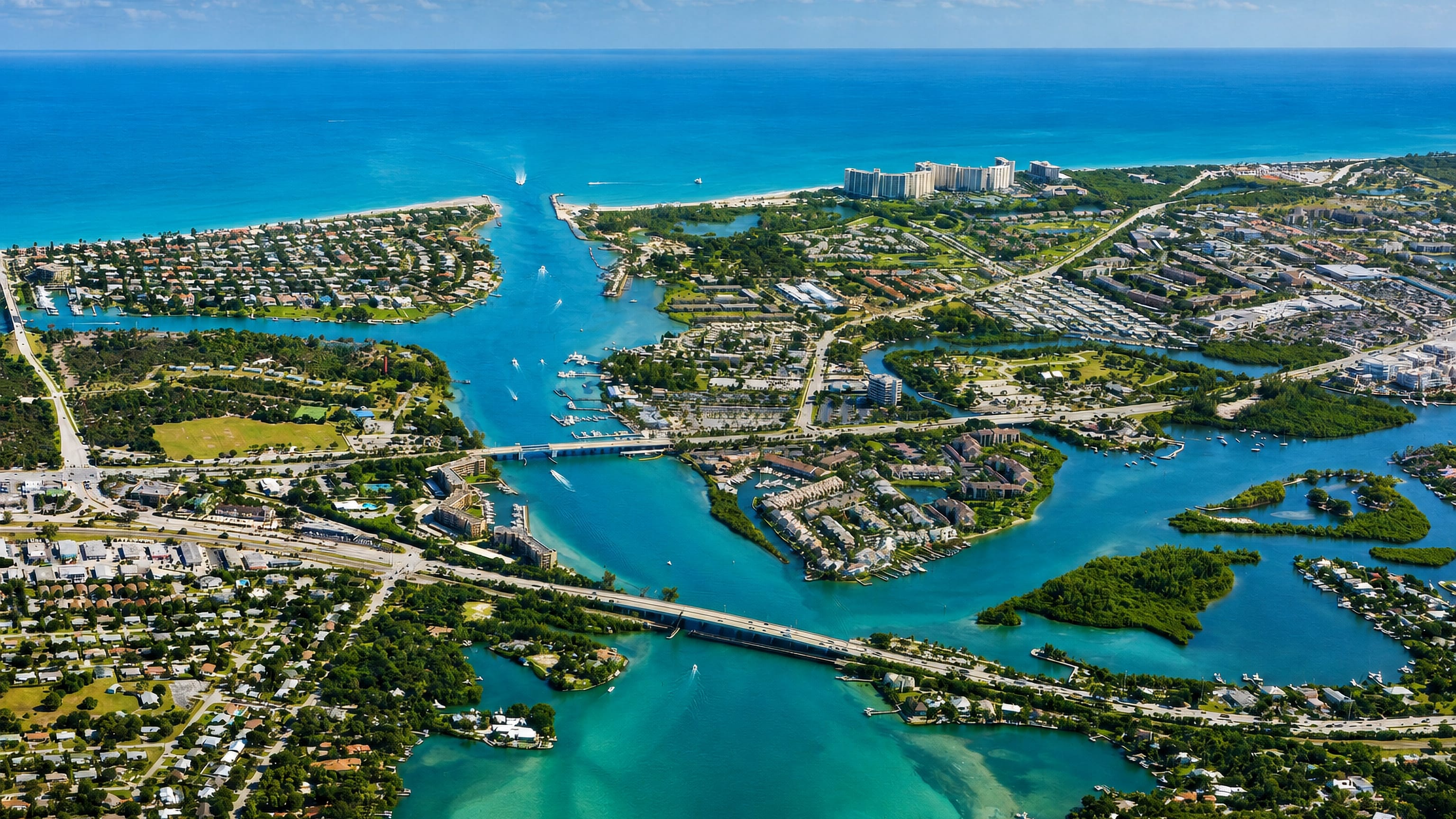 Aerial view of Jupiter, Florida, where the inlet meets the Atlantic between marinas, waterways and island homes